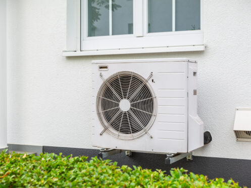 Heat pump installed outside a home.
